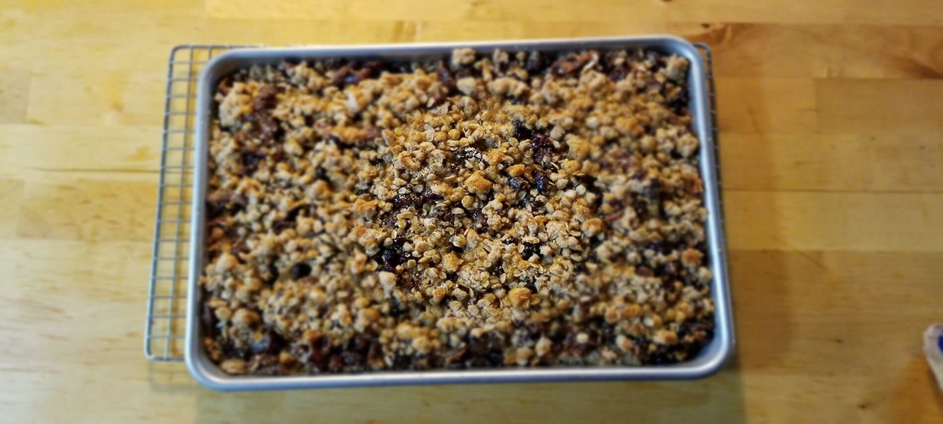 cranberry energy bars on a silver sheet pan